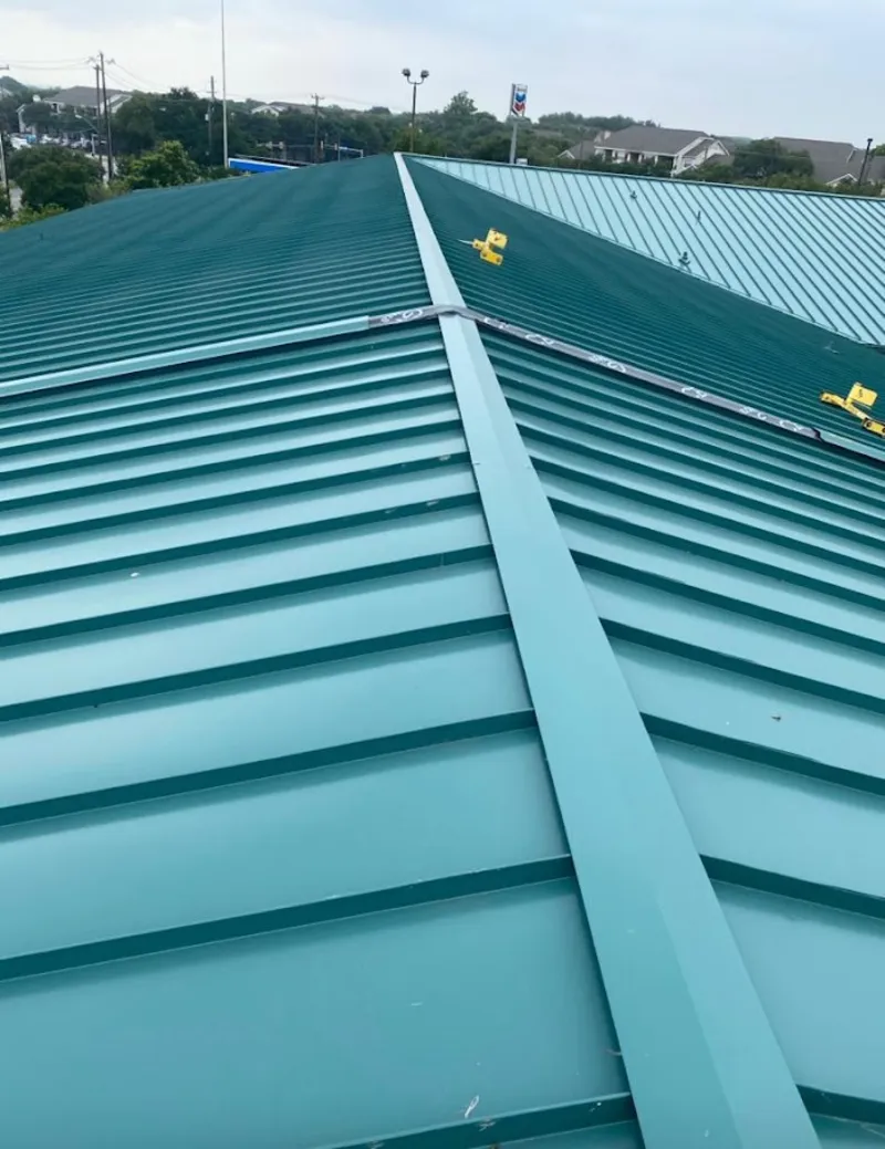 Green commercial metal roof ridge and valley for Metal Roof Repair in Whitefish Bay